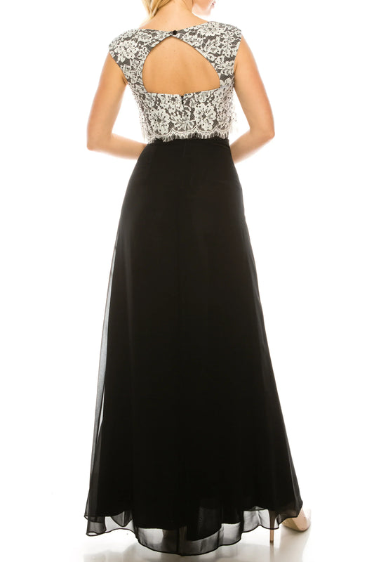 Back view of a woman wearing a mother-of-the-bride gown with a lace bodice and black skirt.