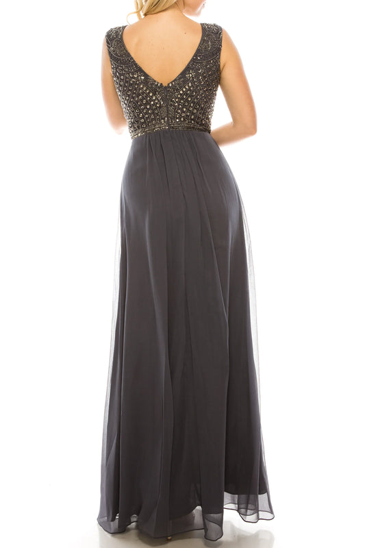Rear view of a charcoal grey evening gown with a beaded bodice and flowing chiffon skirt.