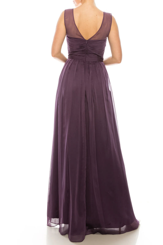 Back view of a woman wearing a floor-length purple chiffon evening gown