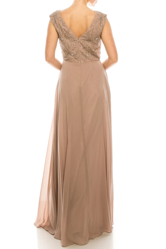 Back view of a champagne mother-of-the-bride gown with beaded bodice and flowing skirt