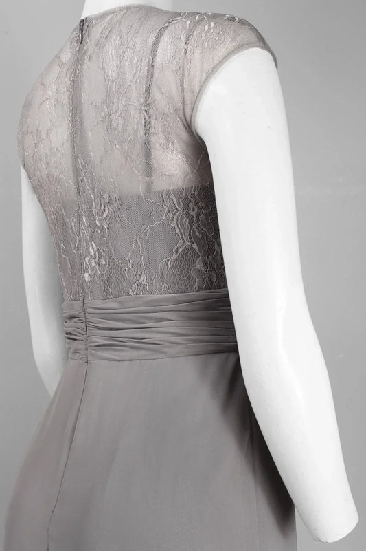 Back view of a grey evening gown with lace bodice and pleated waist on a mannequin