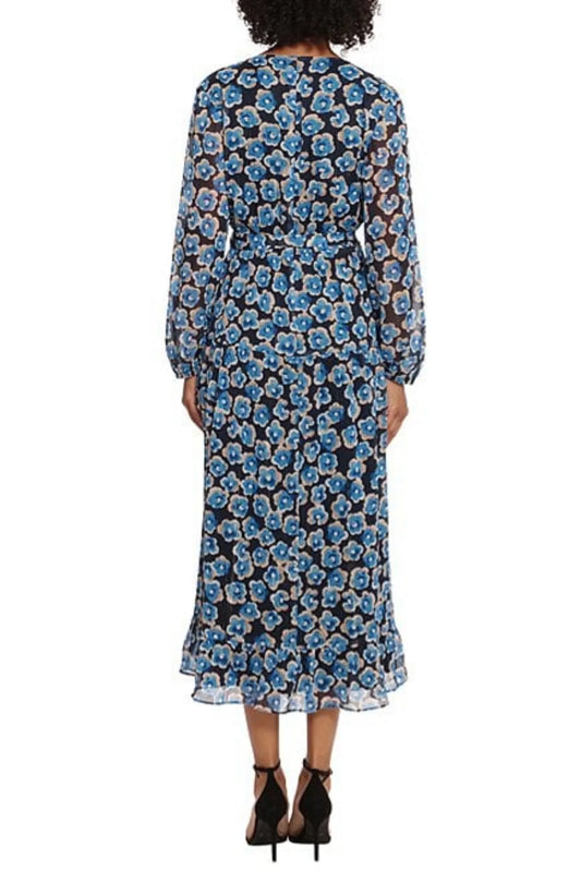 Back view of a woman wearing a navy blue floral midi dress with long sleeves and ruffled hem.