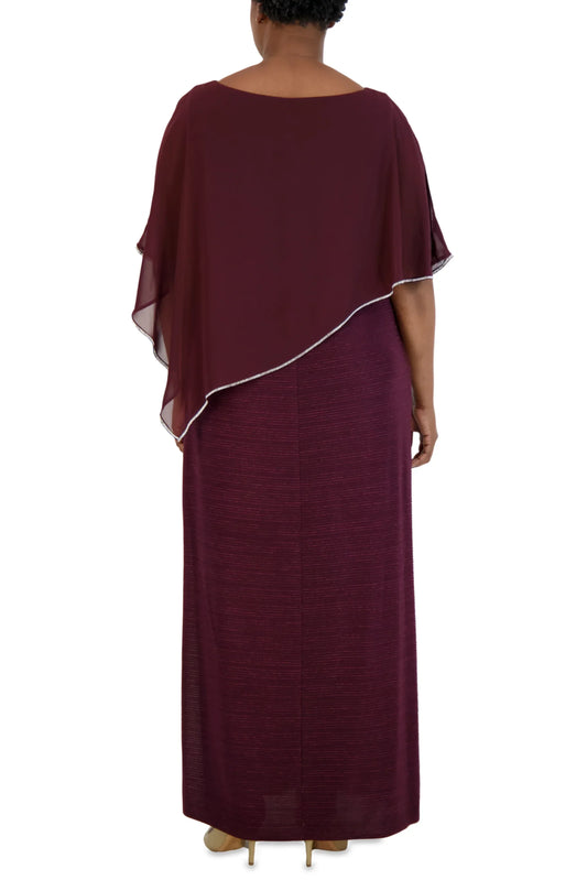 Back view of a woman wearing a burgundy evening gown with a matching sheer capelet.