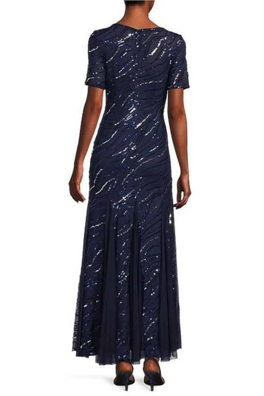 Back view of a woman wearing a navy blue sequined formal maxi dress with short sleeves