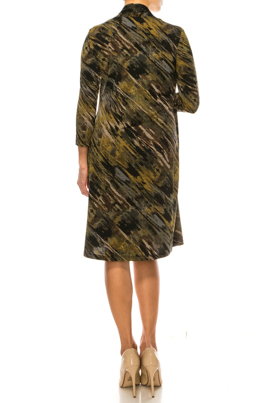 Back view of a woman wearing a patterned olive and black midi-length coat and nude pumps.
