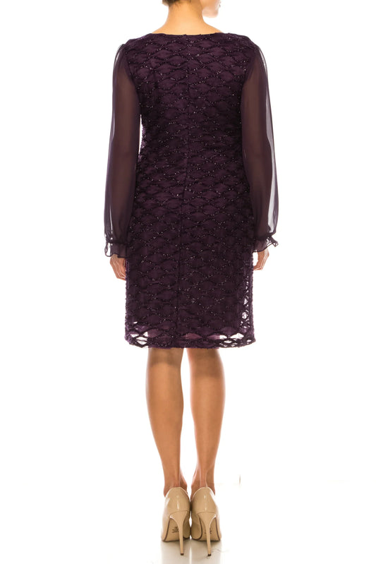 Back view of a woman wearing a purple knee-length lace dress with sheer sleeves.