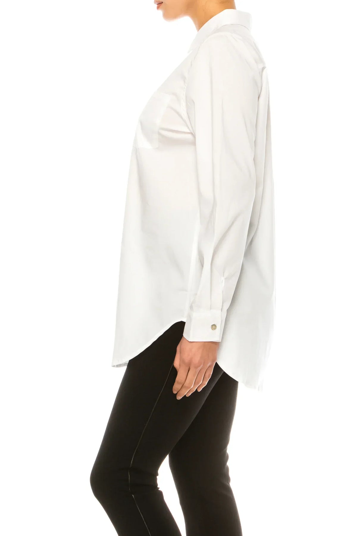 Woman wearing a crisp white long-sleeve button-down shirt and black trousers.
