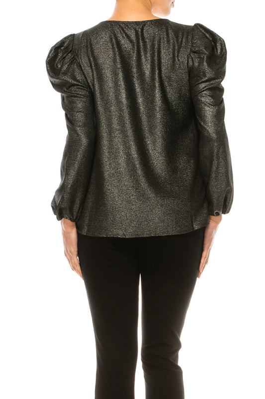 Rear view of a woman wearing a shimmering metallic black blouse with puff sleeves and black pants