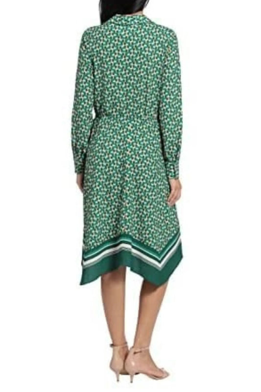 Rear view of a woman wearing a green and white printed midi dress with a striped hem.