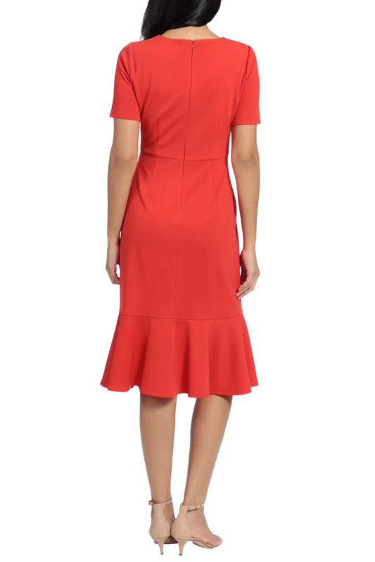 Rear view of a woman wearing a short-sleeved red midi dress with a flounce hem.