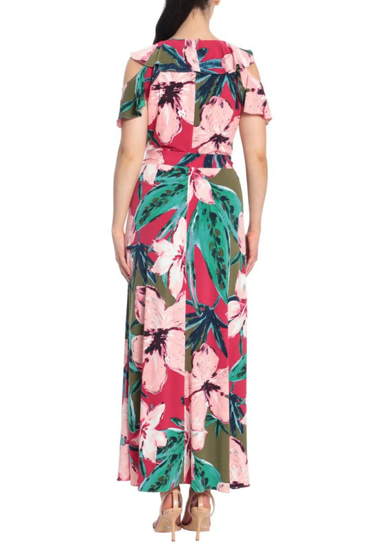 Back view of a woman wearing a floral print red and green cold shoulder maxi dress