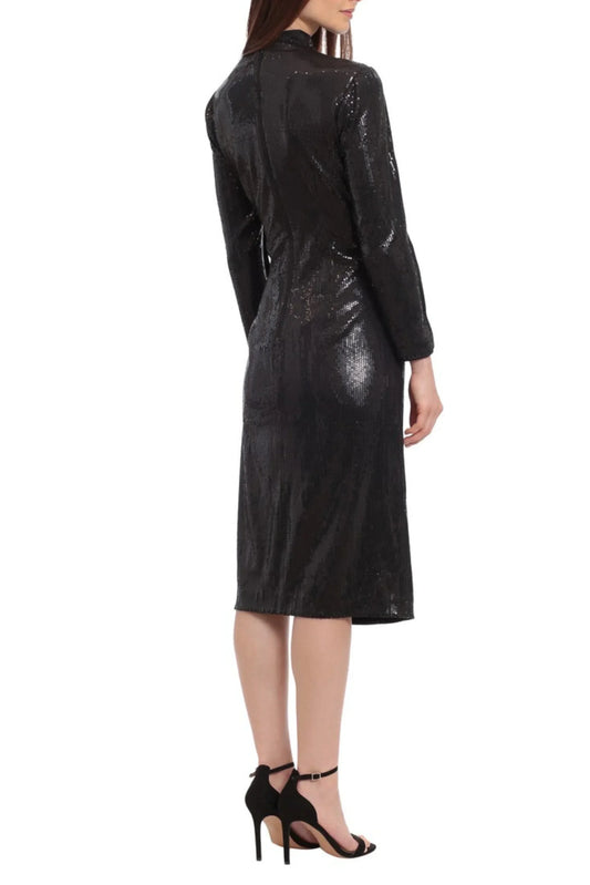 Back view of a woman wearing a long-sleeved black sequin midi dress and black heels.