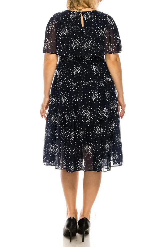 Back view of Maison Tara navy blue dot print cape tiered A-line midi dress