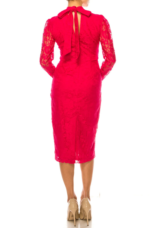 Back view of a woman wearing a hot pink lace midi dress with a bow detail and nude heels.