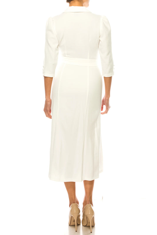 Back view of a woman wearing an elegant white midi dress and beige pumps