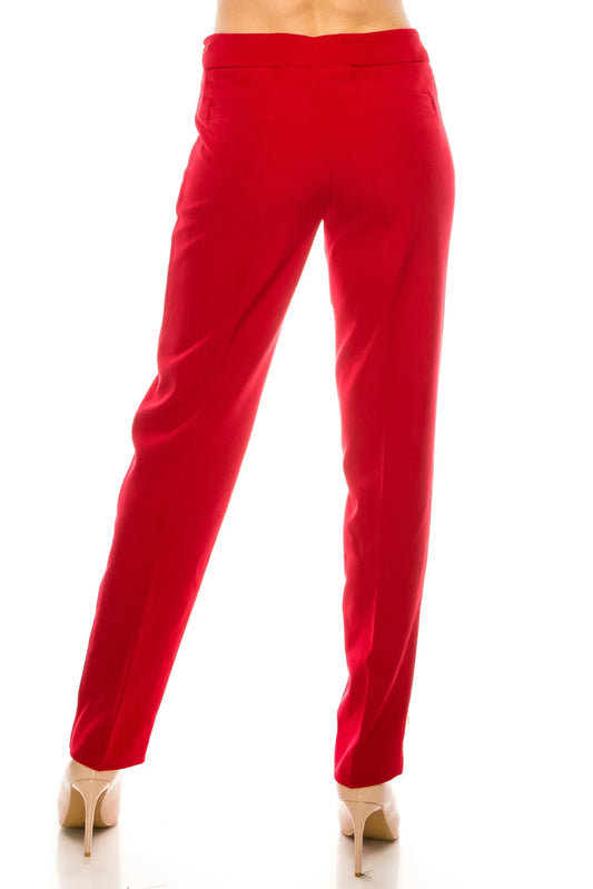 Rear view of a woman wearing elegant red tailored dress pants and beige high heels.