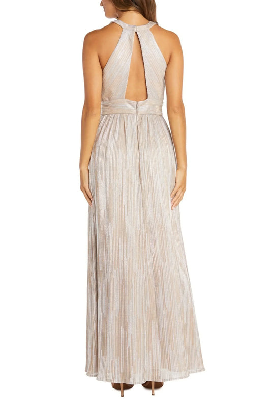 Back view of a woman wearing an elegant champagne pleated halter maxi dress with an open back.
