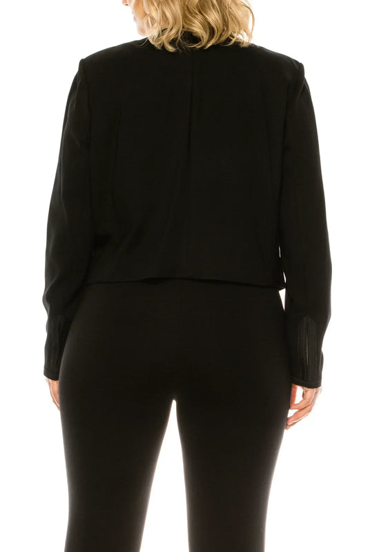 Back view of a woman wearing a NYGARD black double breasted crop blazer and black trousers.