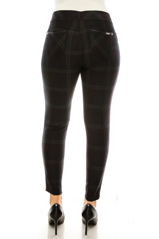 Rear view of NYGARD navy plaid print skinny jeggings with three pockets and black heels.
