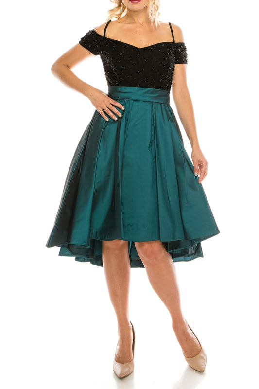 Woman wearing a black beaded off-the-shoulder top and a teal satin A-line skirt.