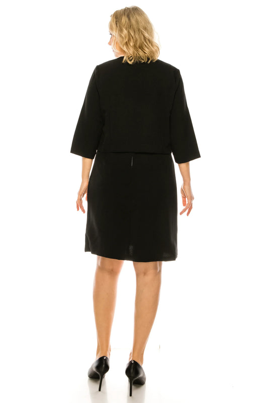 Rear view of a woman wearing a Phase Seven black 2 piece jacket dress and black pumps.