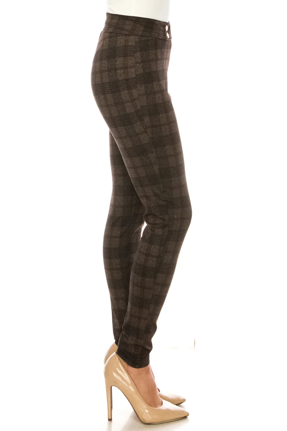 Woman wearing brown plaid slim-fit trousers and nude pointed-toe pumps.