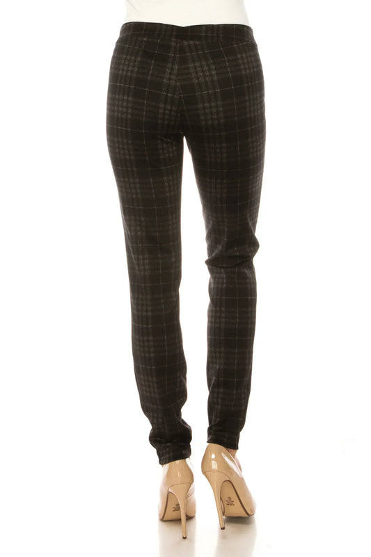 Back view of women's slim-fit black and grey plaid trousers with beige high heels