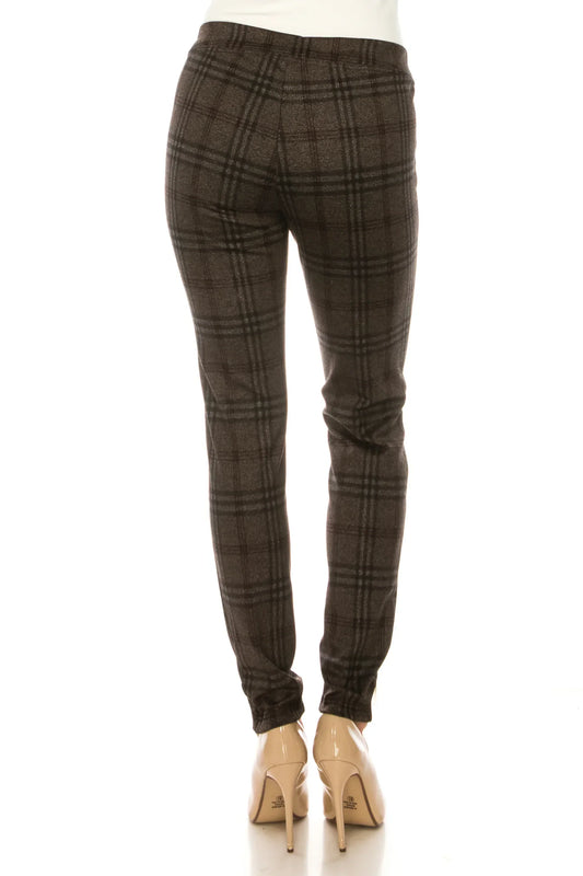Back view of women's brown plaid tailored slim-fit trousers with beige pumps