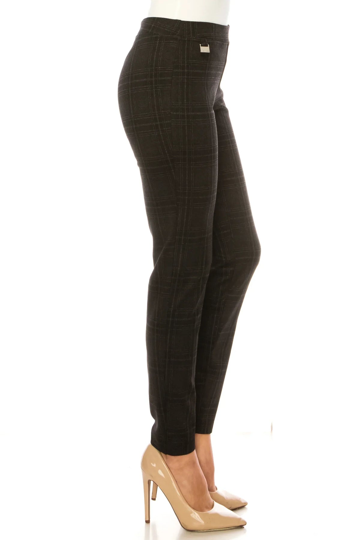 Woman wearing charcoal grey plaid slim-fit trousers and nude pointed-toe pumps.