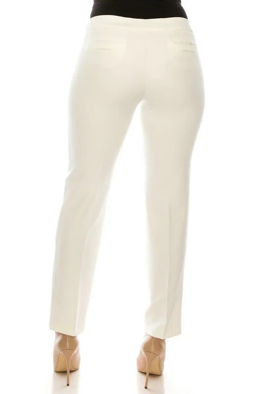 Back view of a woman wearing elegant white tailored trousers and nude high heels.