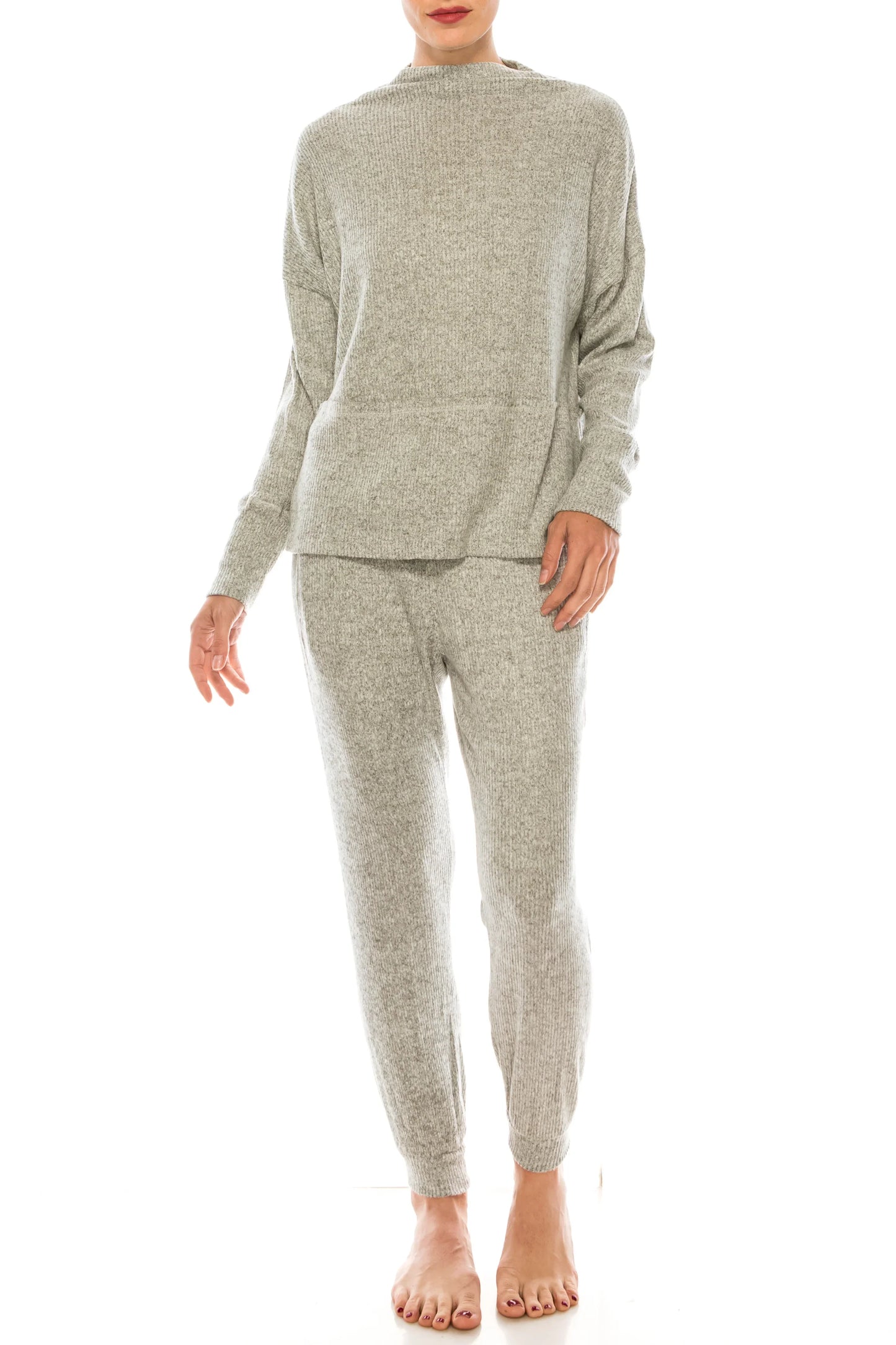 Woman wearing a light grey knit two-piece loungewear set with a sweater and matching pants.